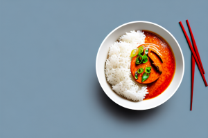 A bowl of steaming jasmine rice with thai red curry paste
