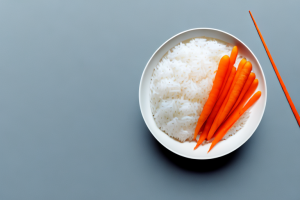 A bowl of cooked jasmine rice with carrots