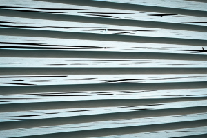 A plantation shutter with broken slats