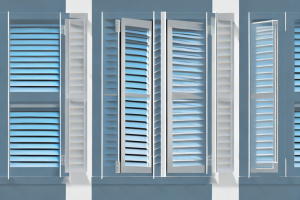 A window with pvc shutters in various stages of being opened and closed